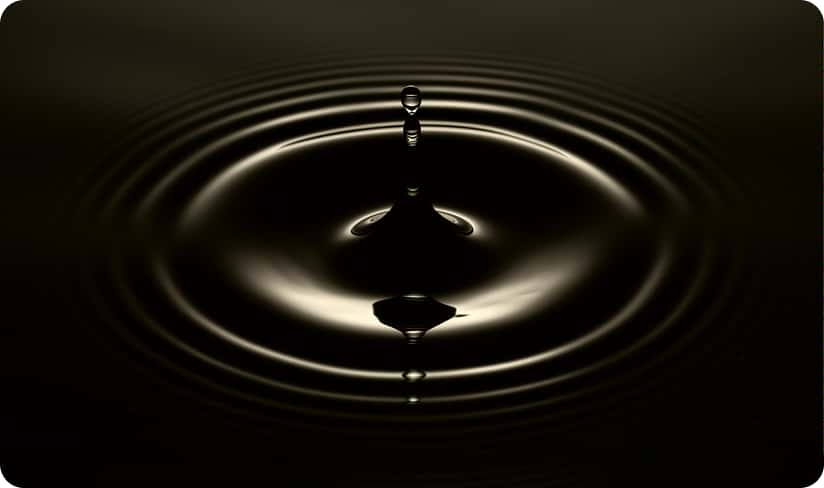 Water droplet creating concentric ripples